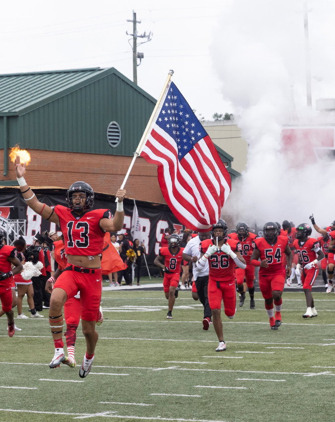 VSU Football Team running onto football field